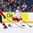 BUFFALO, NEW YORK - DECEMBER 26: Belarus forward Sergei Pischuk #14 skates with the puck past Switzerland's Tobias Geisser #12 during the preliminary round of the 2018 IIHF World Junior Championship. (Photo by Andrea Cardin/HHOF-IIHF Images)

